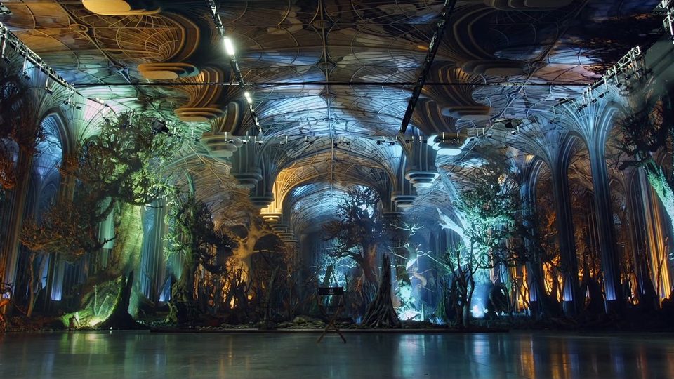An immersive projection stage lit for a show